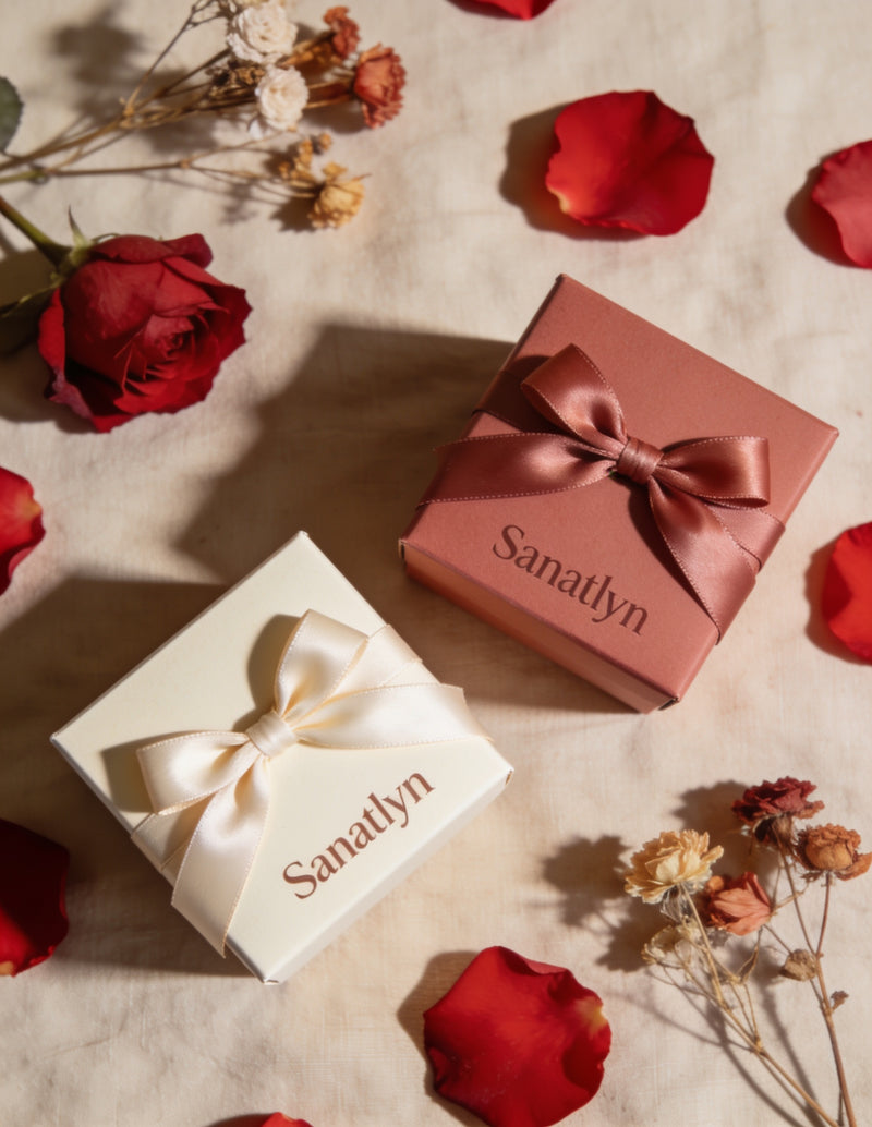 Sanatlyn Valentine's Vault gift sets, unbranded kraft and rose gift boxes with satin ribbons and scattered rose petals