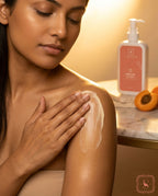 Woman applying Sanatlyn Aprikoze Lotion to her arm with a bottle of lotion in the background