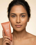 Woman holding a  Sanatlyn 3-in-1 Face Cleanser with a beige background