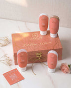 Sanatlyn body care products with a decorative box on a marble surface.