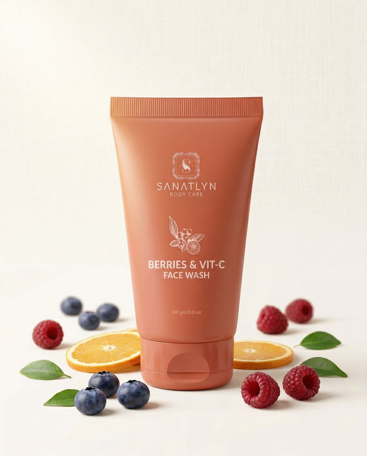 Sanatlyn Berries & Vit-C Face Wash tube with fruits and leaves on a light background